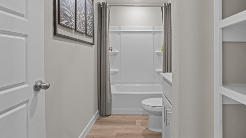 Guest bathroom located between guest bedrooms
