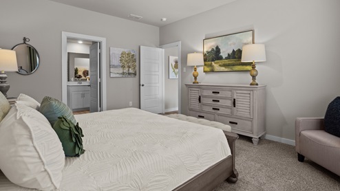 Primary bedroom with private attached bathroom and walk-in closet