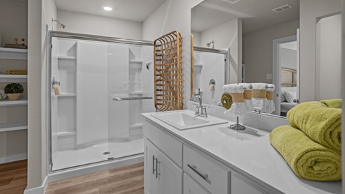 Primary bathroom with luxurious shower and built in storage
