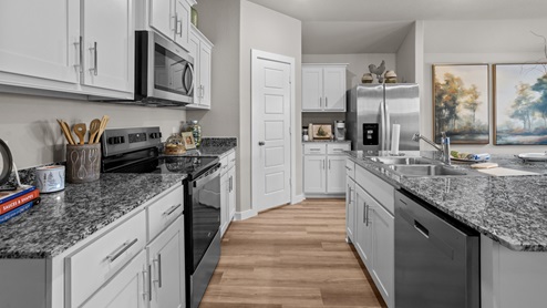 Spacious open concept kitchen with island and counter prep space