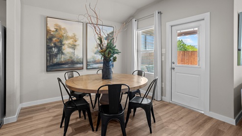 Open dining room space adjacent to kitchen