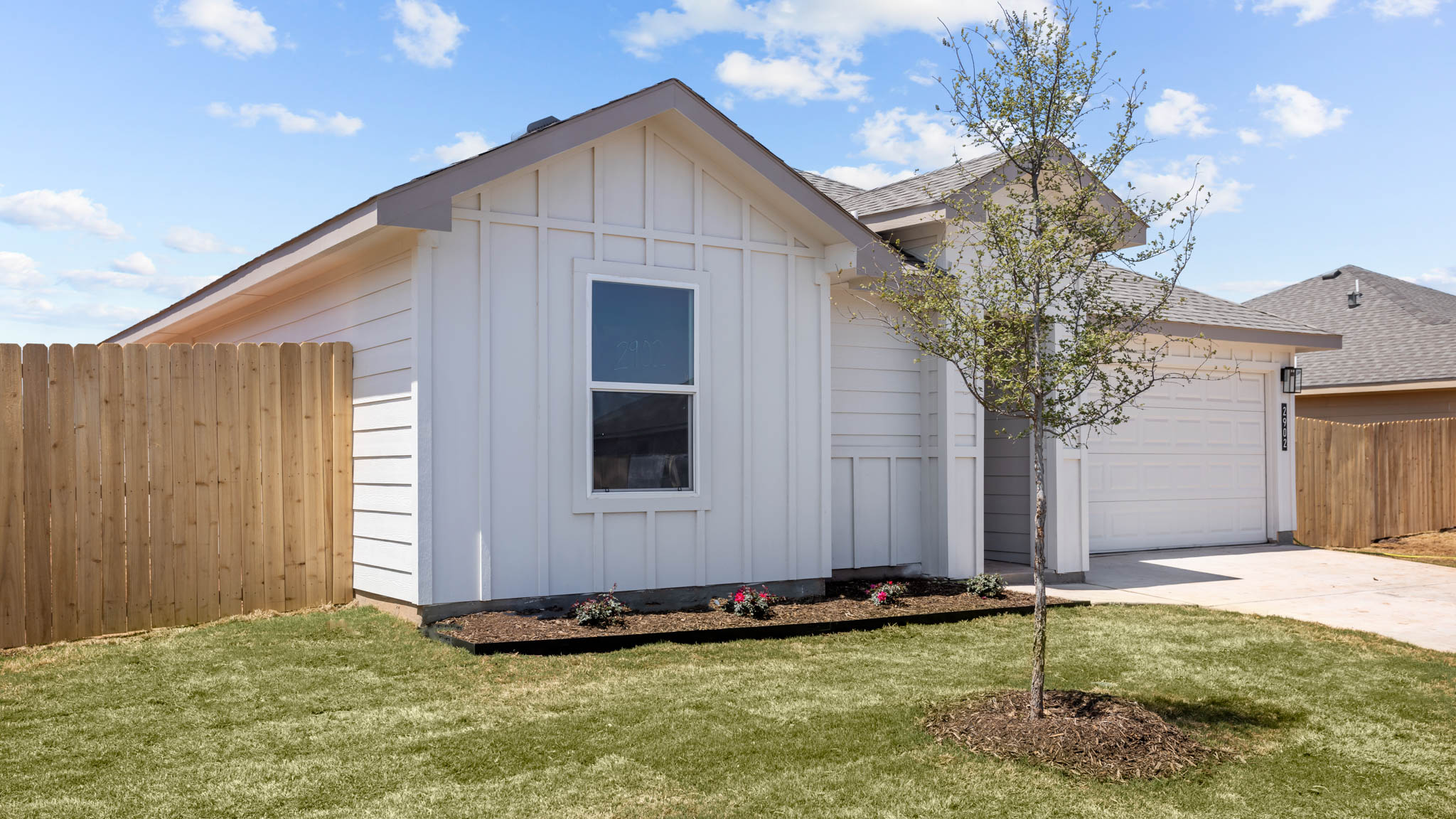 Single story modern farmhouse home with front entry