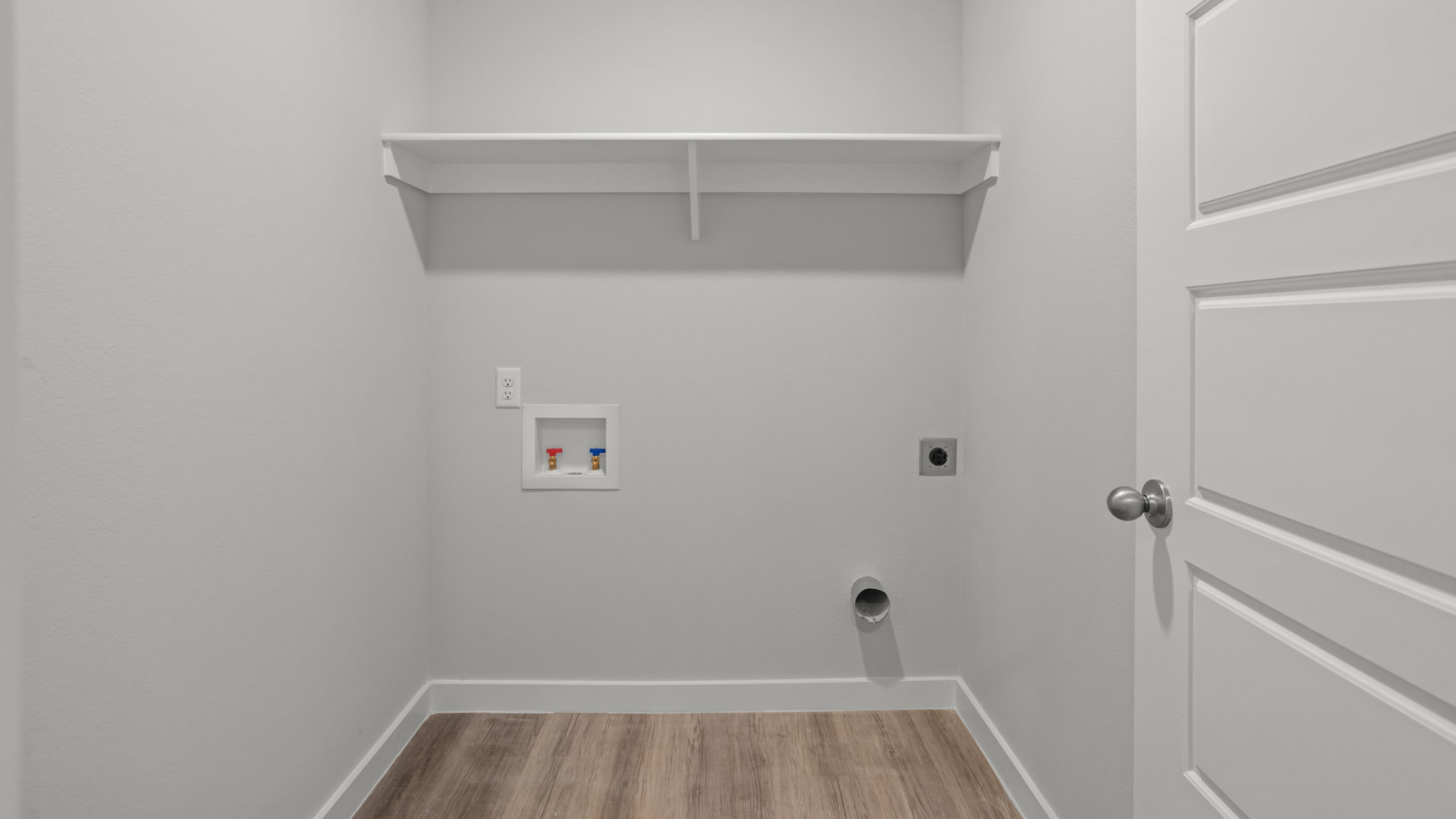 Laundry room and utility closet space with extra storage