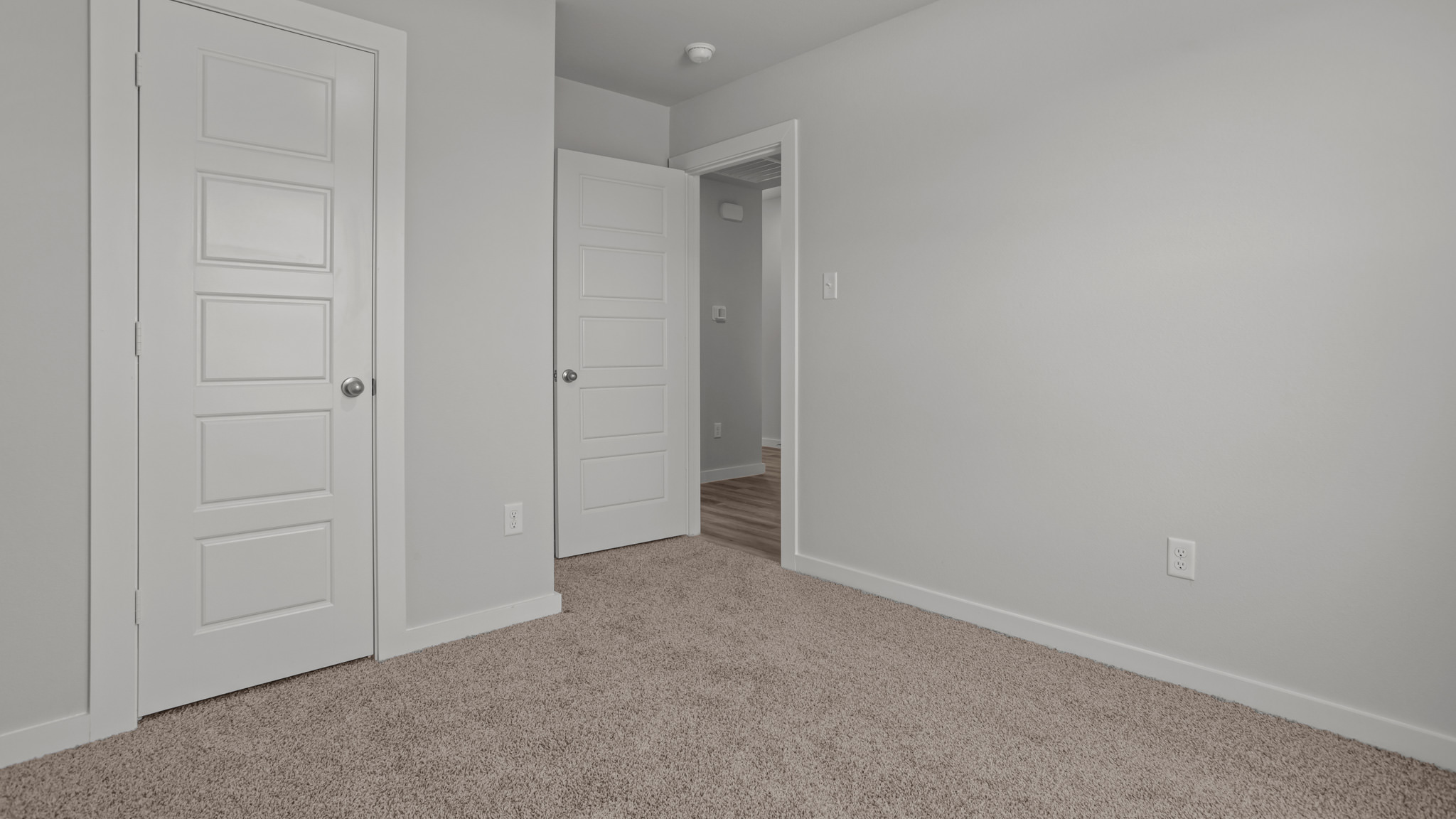 Guest bedroom 1 with front windows and ample natural light