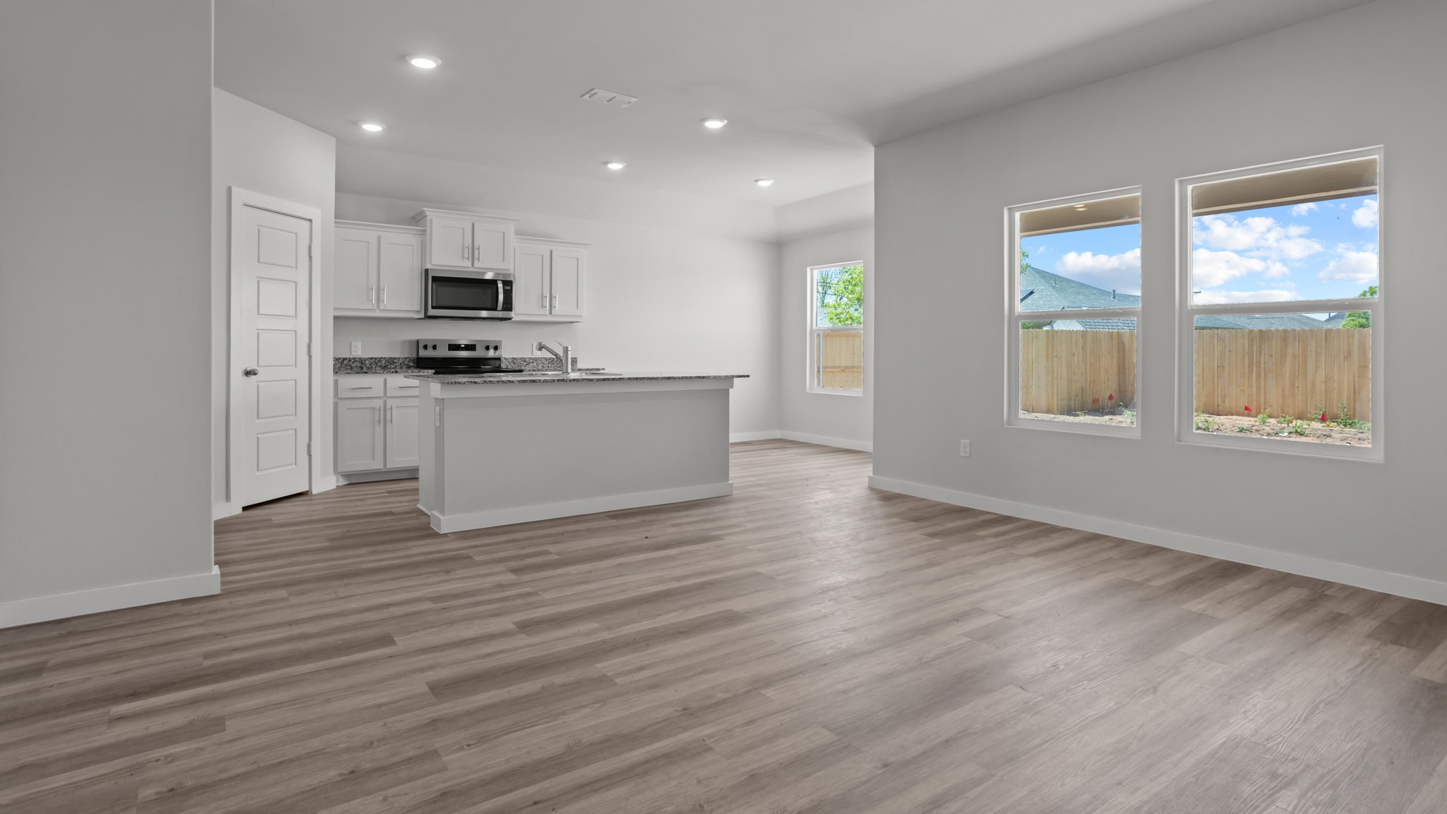 Open concept kitchen, living, family, and dining room space