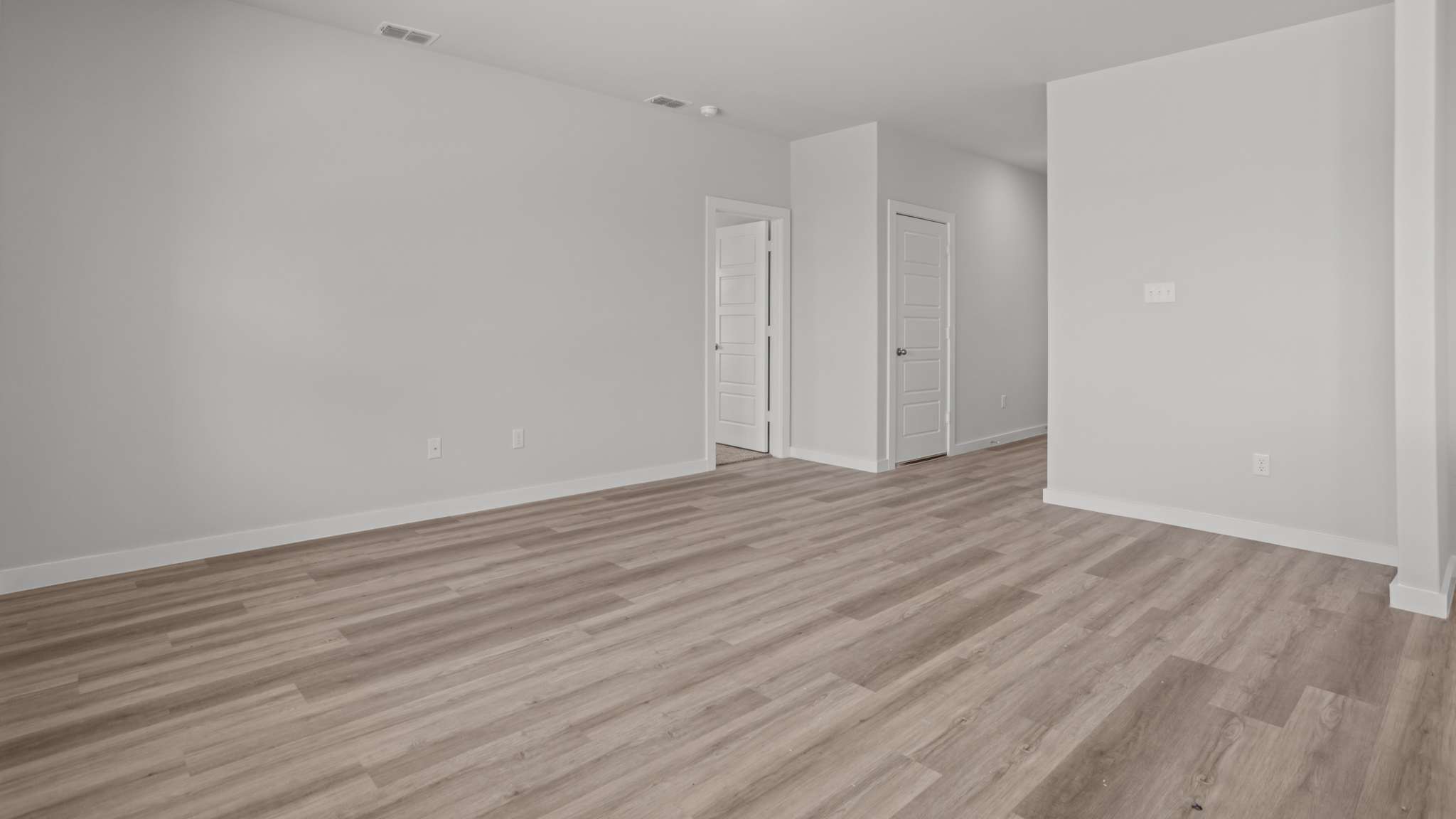 Open living and family room area with ample natural light