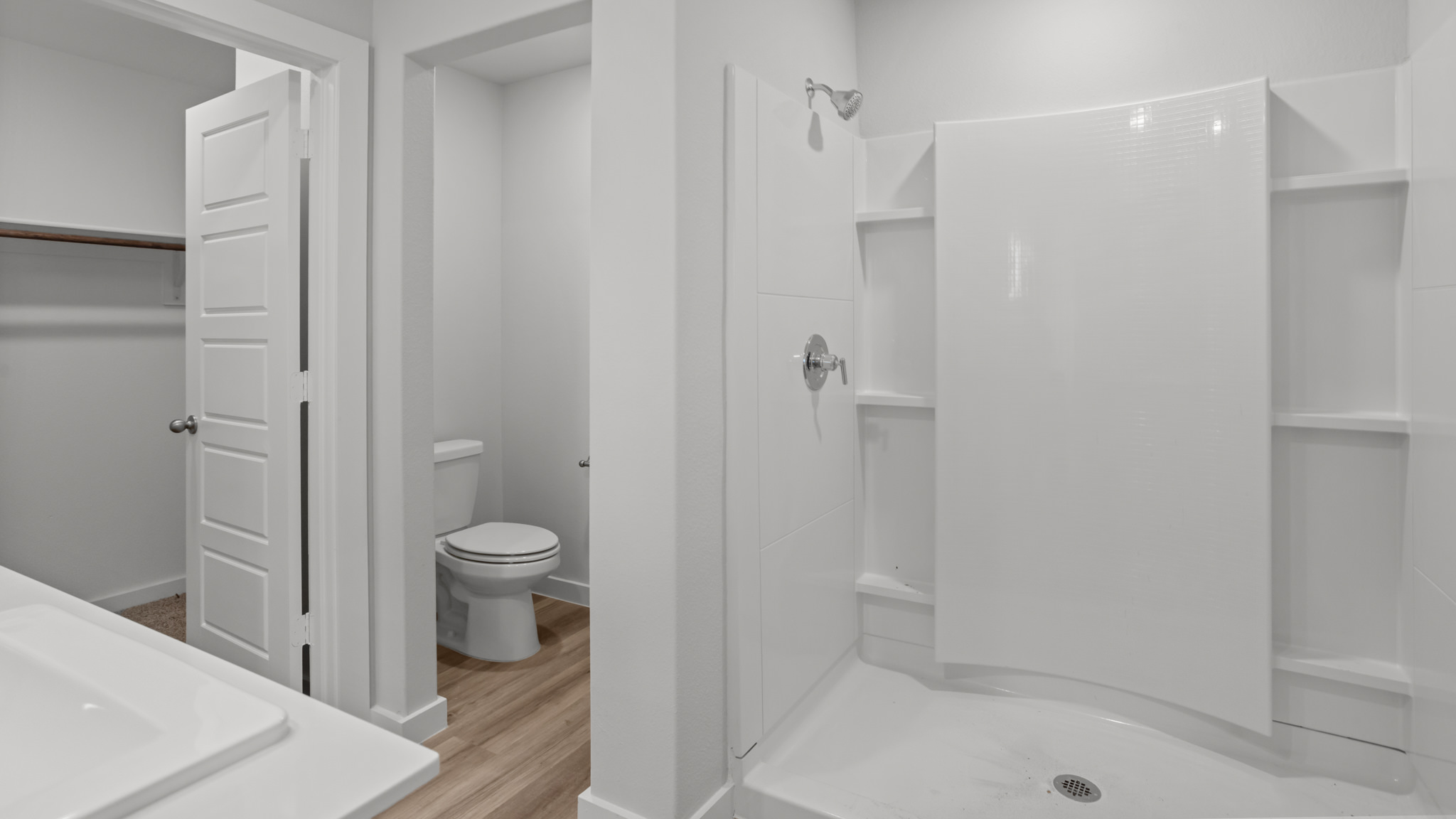Primary bathroom with luxurious shower and private water closet