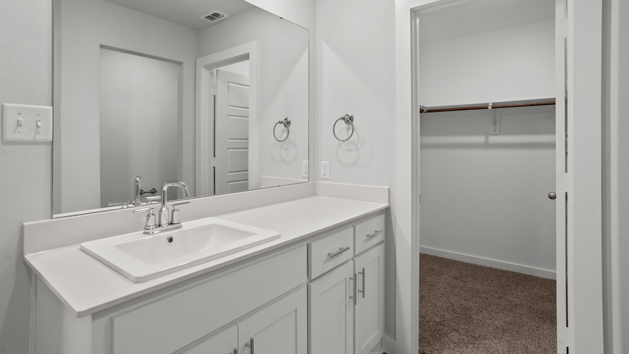 Private attached primary bathroom with built in vanity