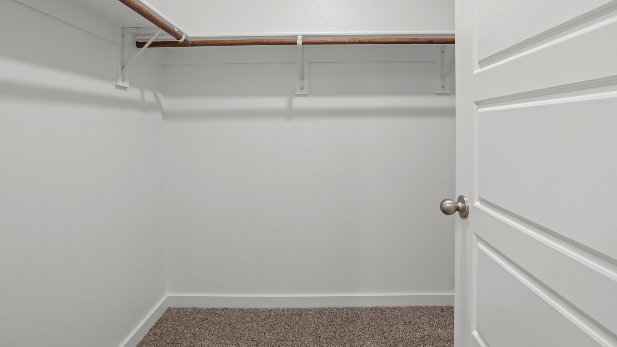 Primary walk-in closet with extra storage space