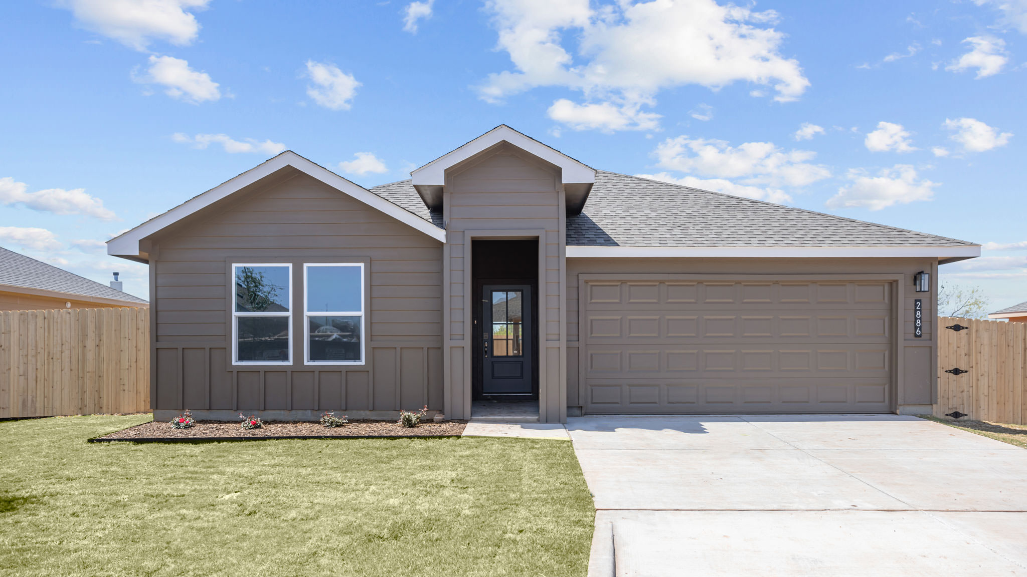 Exterior of single story modern farmhouse home