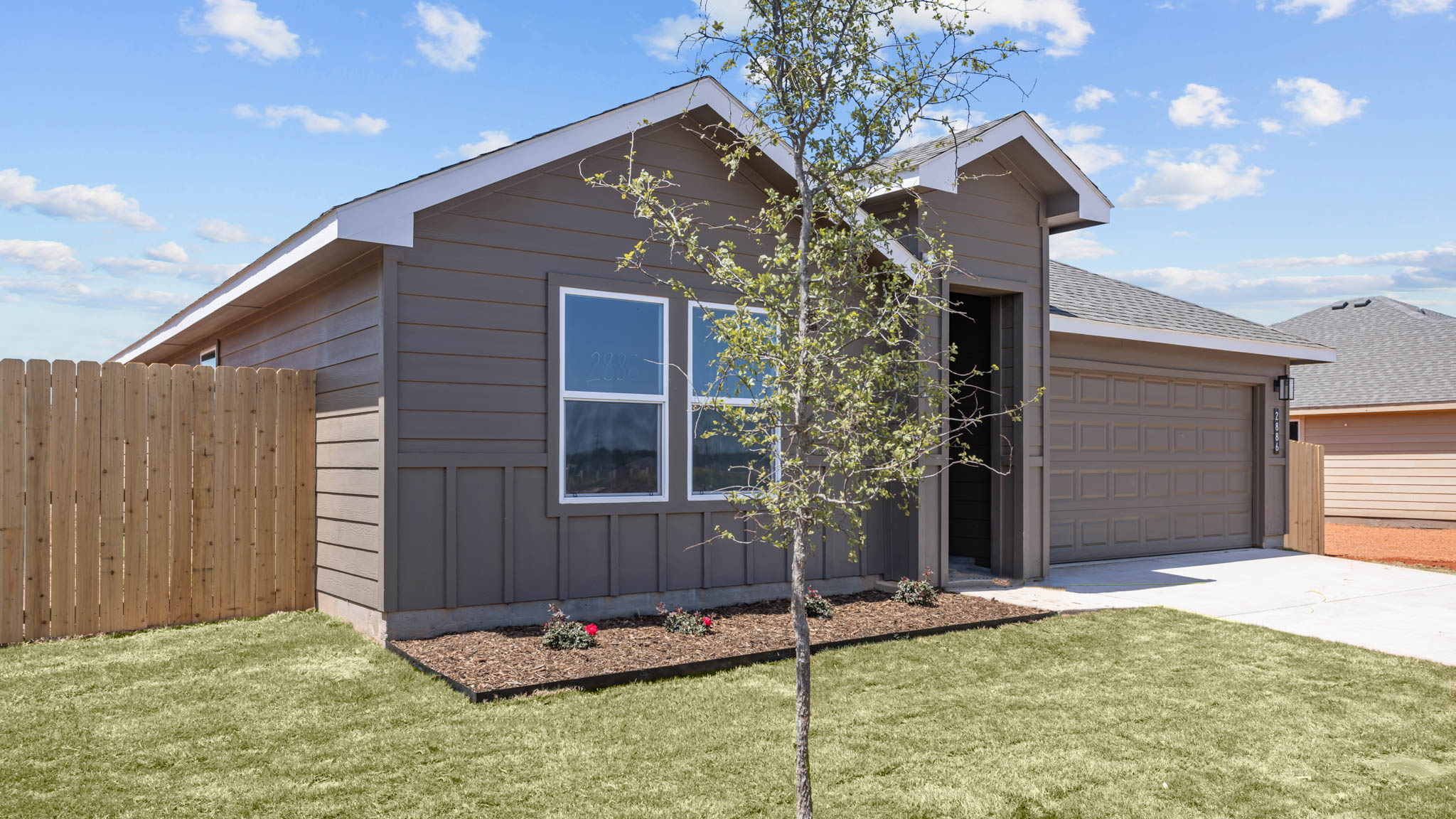 Single story modern farmhouse home with front entry