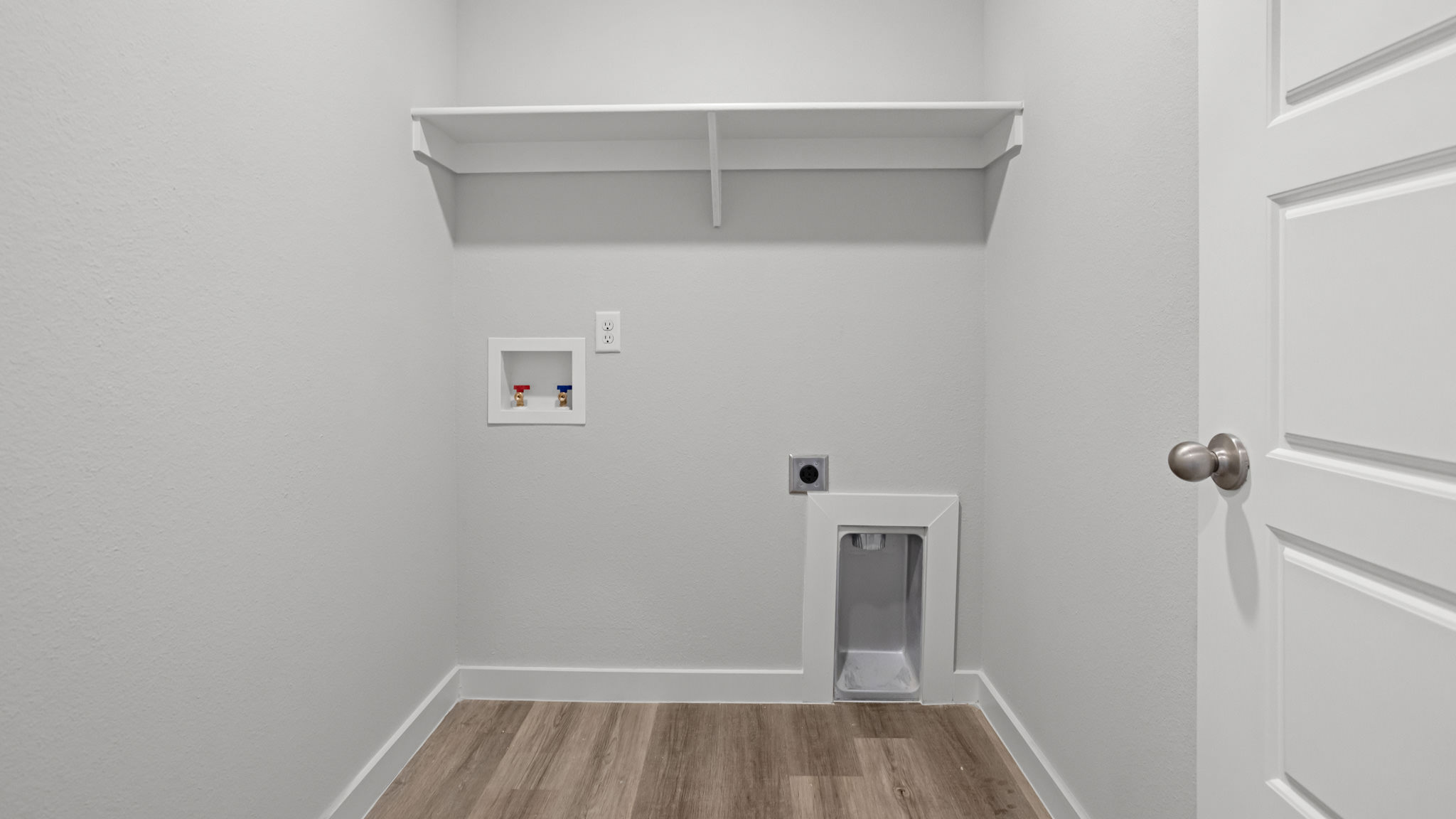 Laundry room and utility closet space with extra storage