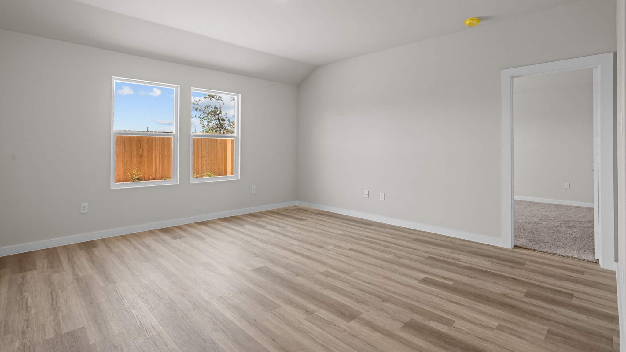 Open living and family room area with ample natural light