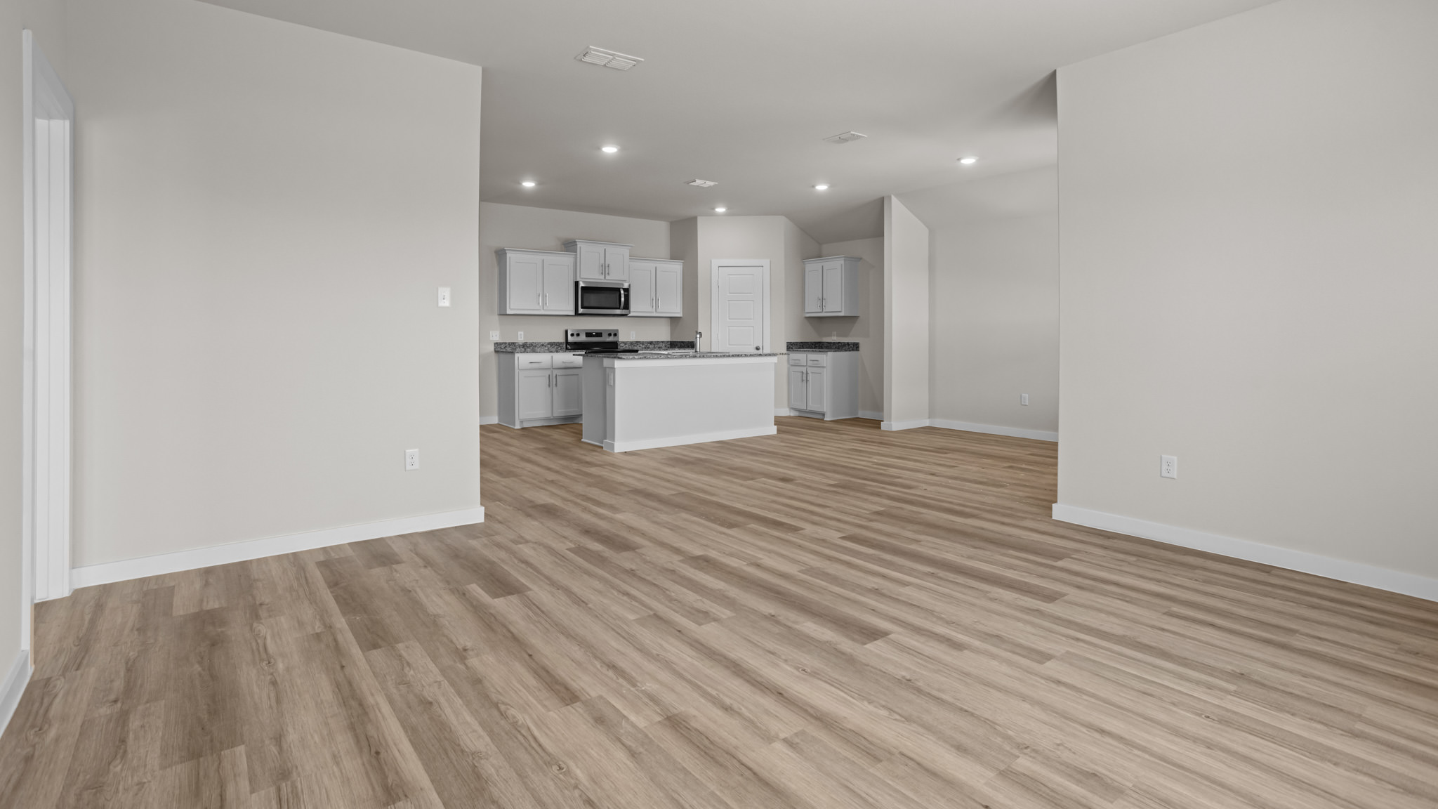 Open concept kitchen, living, family, and dining room space