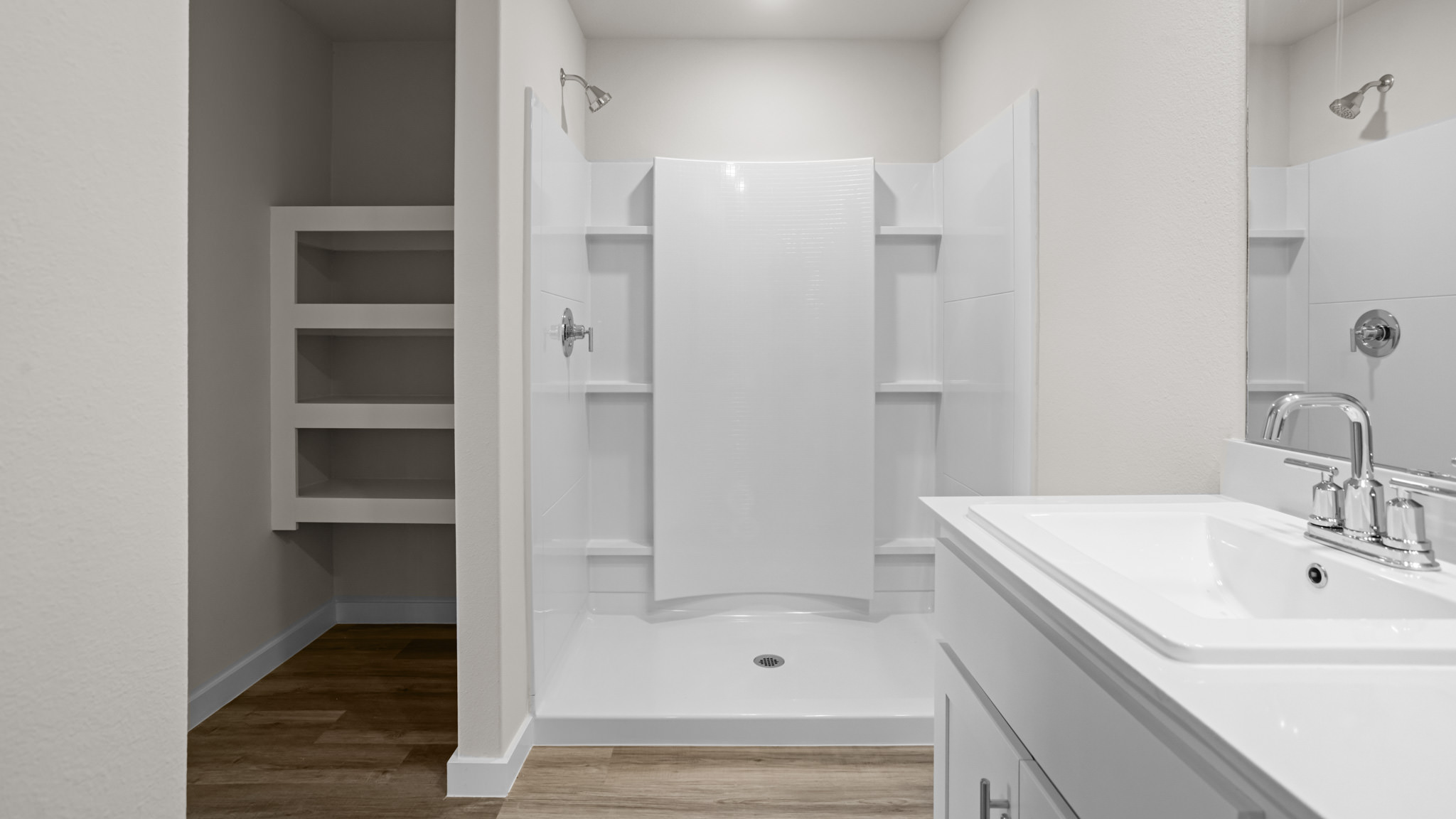 Primary bathroom with luxurious shower and built in storage