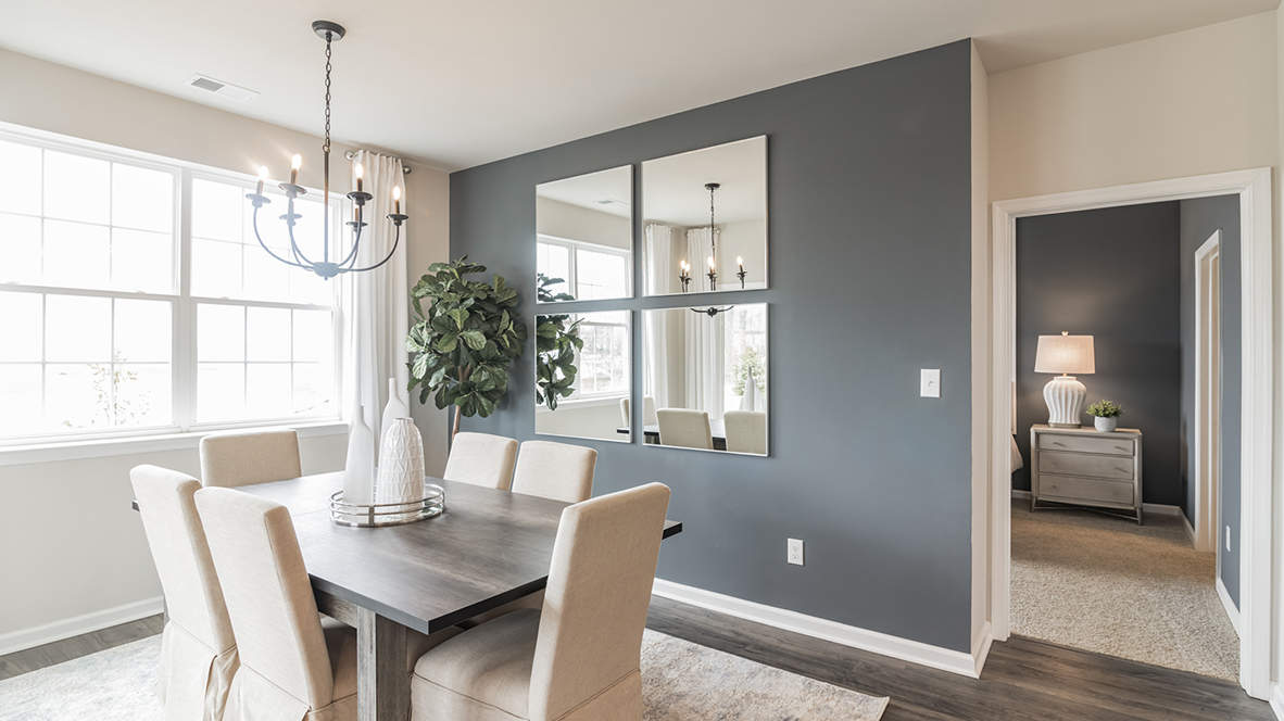 Dining area with blue accent wall.