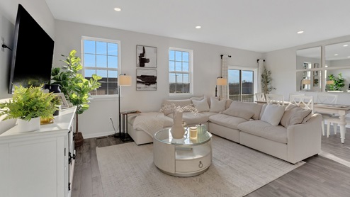 Large living area with plenty of natural light.