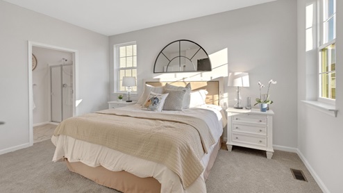 The primary bedroom has two windows.