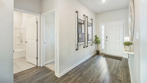 You are welcomed into the home stepping into the wide foyer.