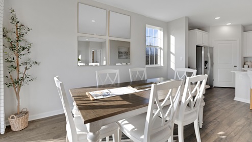 The dining area flows nicely into the functional kitchen.