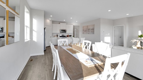 The dining area flows nicely into the functional kitchen.