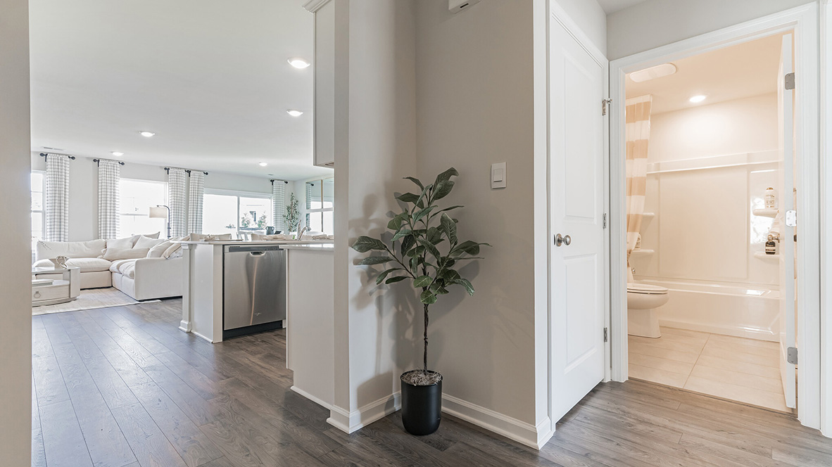 The foyer leads you to the guest bathroom on one side.