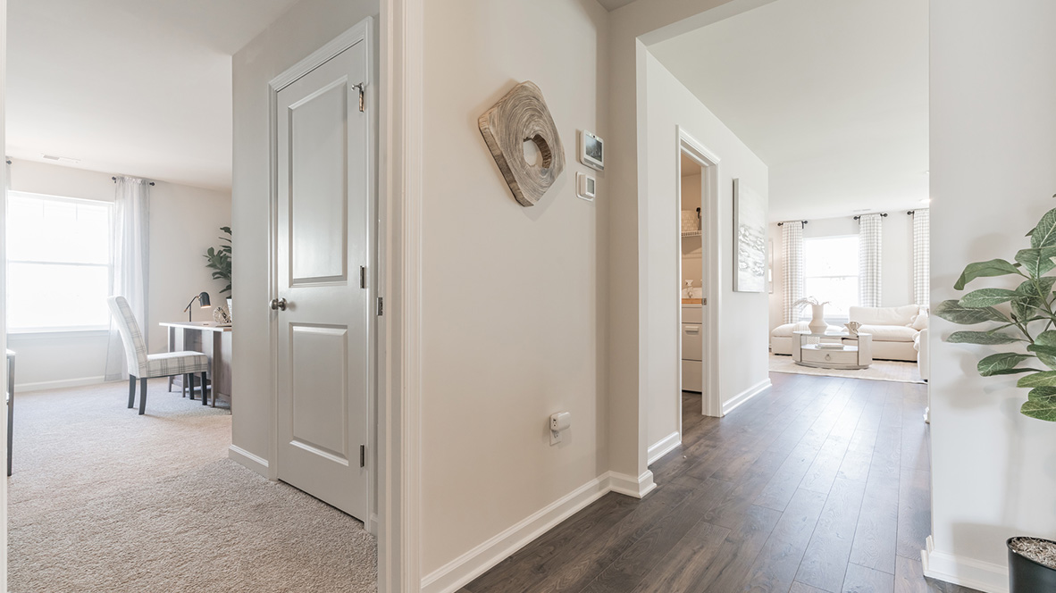 The foyer leads you to the third bedroom on the other side.