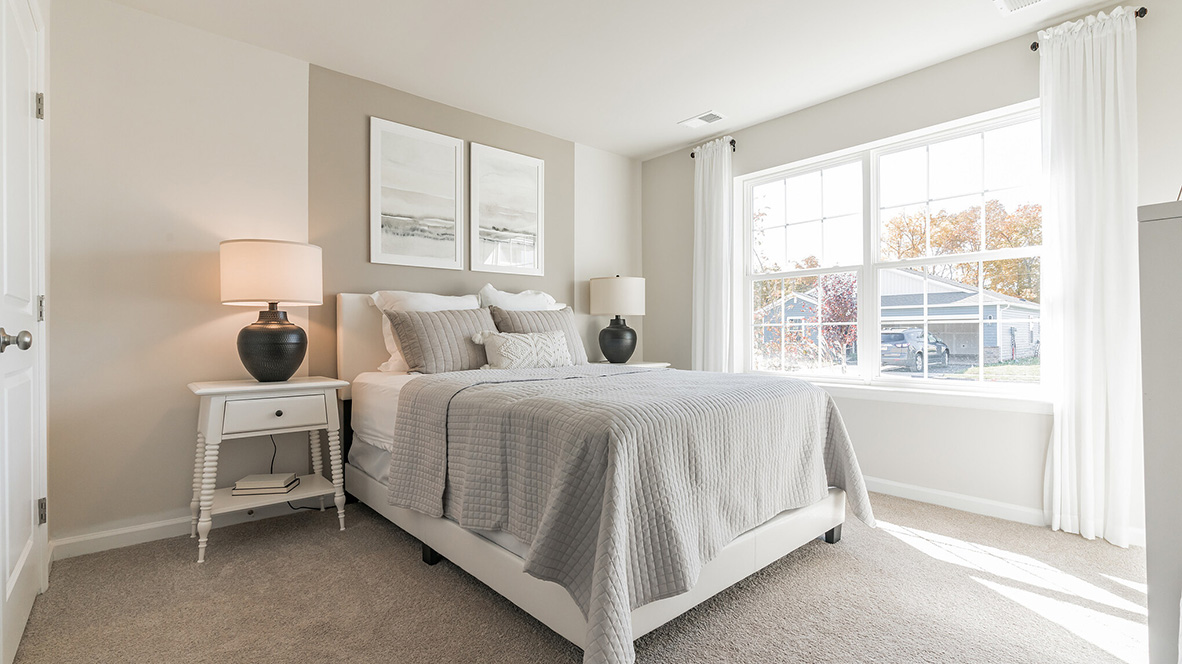 A spacious guest bedroom with a closet is in the front of the home.