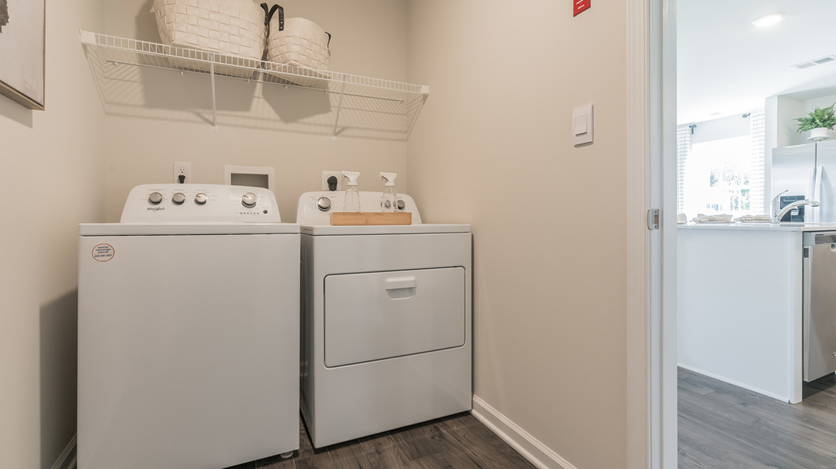 The laundry room is located just off the kitchen.