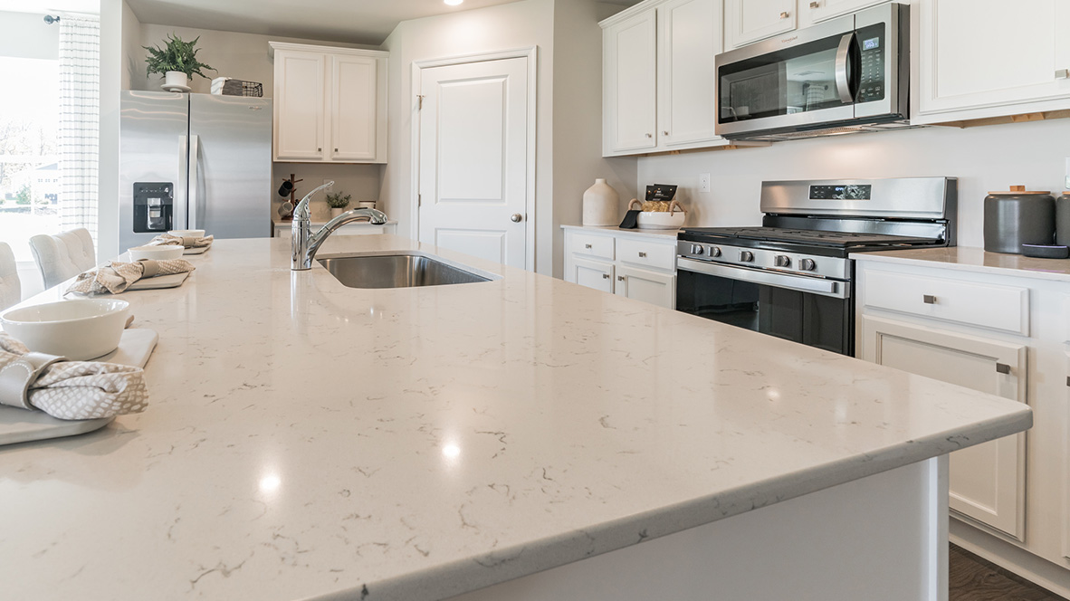 The home's well-designed kitchen features a large center island.