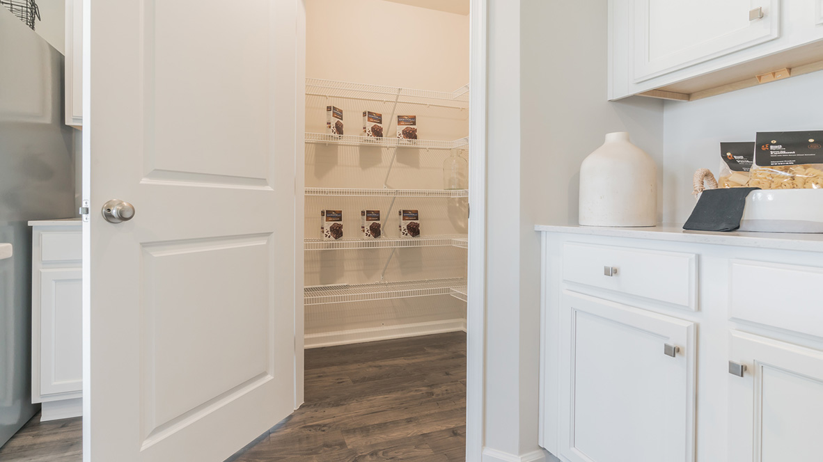 The home's well-designed kitchen offers a generous corner pantry.