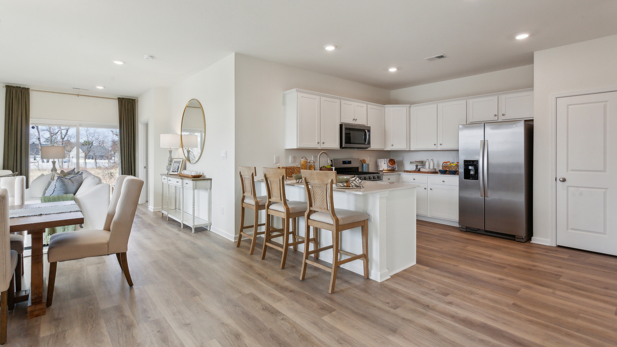 The kitchen is open to the informal dining area.