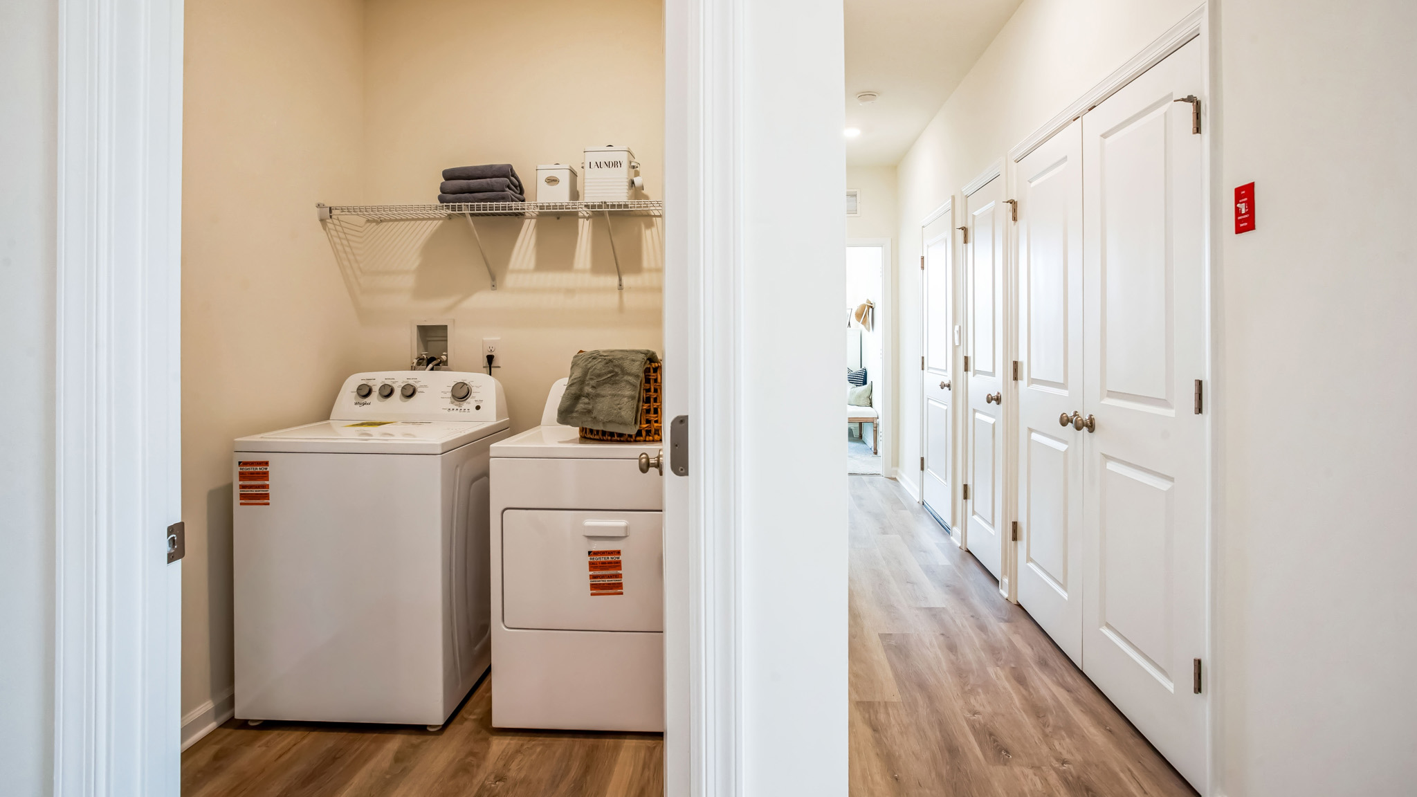 The laundry room comes complete with a washer and dryer.
