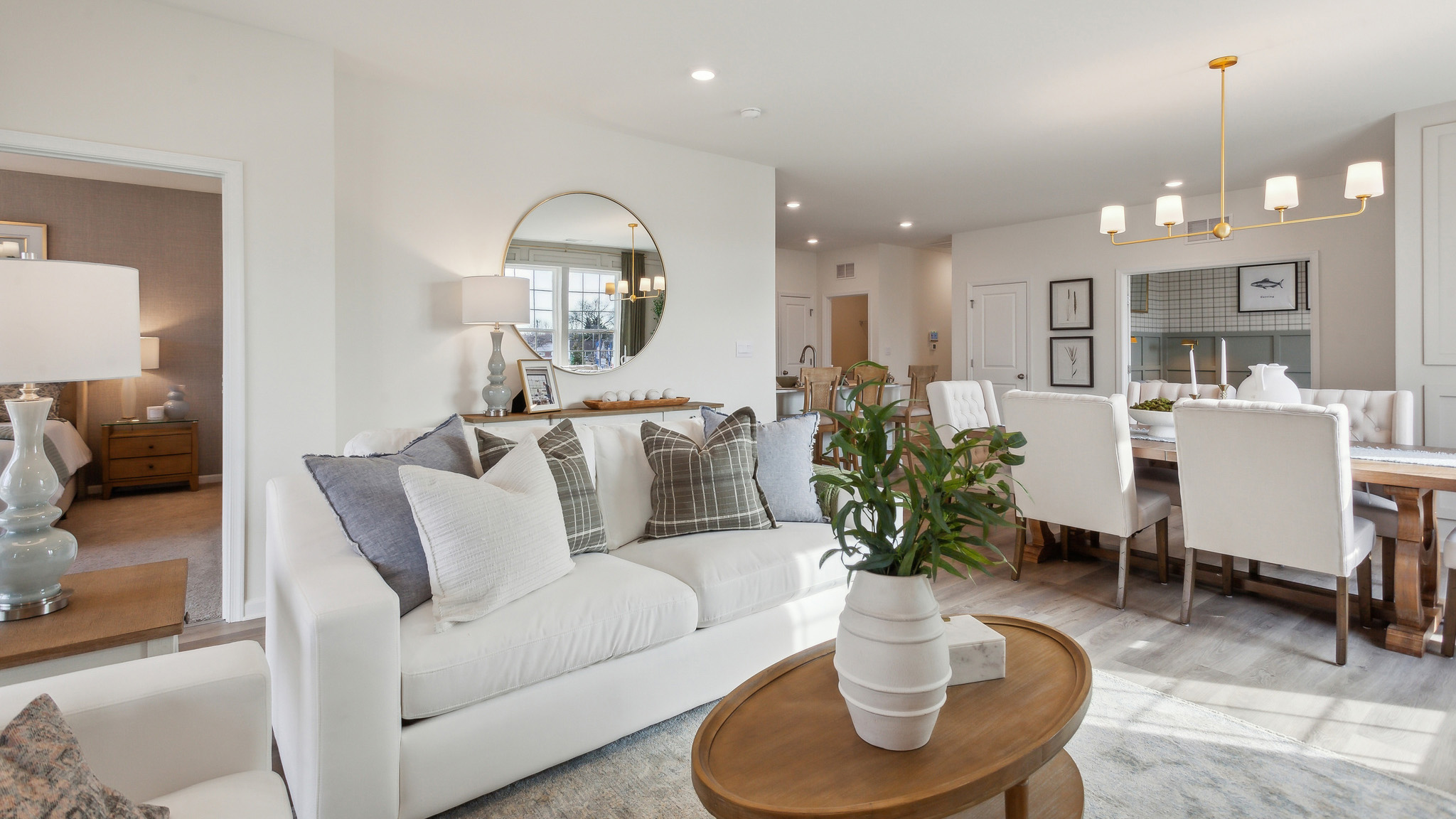 The living area with a peak into the primary bedroom.