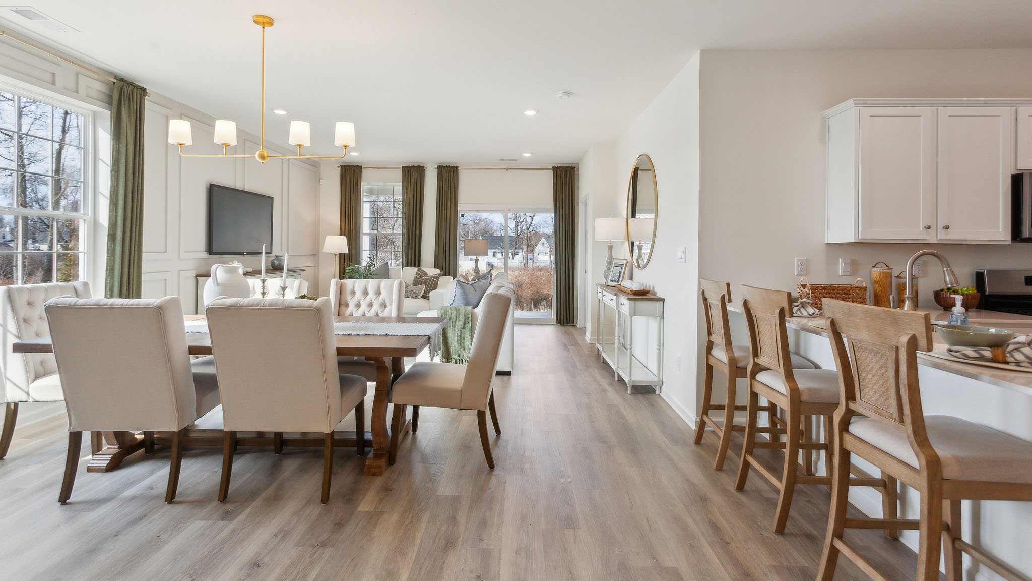 Open concept living, dining, and kitchen area. View from the living room side.