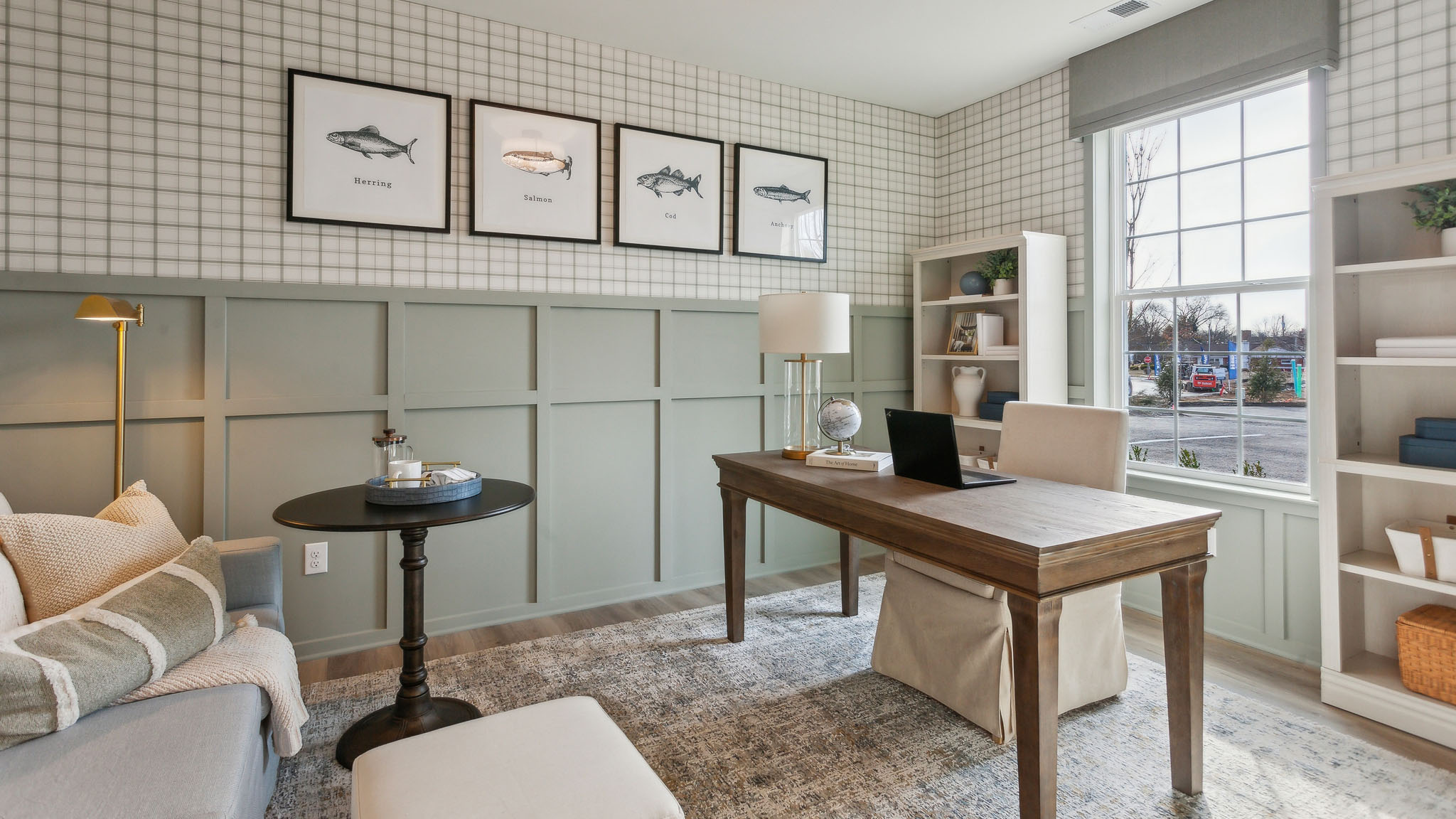 A den is located outside the front entryway and can be closed off with french doors.