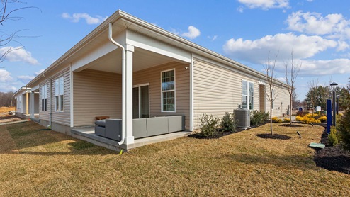 An rear exterior view of the covered patio.