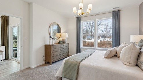 The primary bedroom has a large double window.