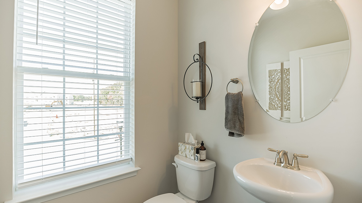 Half bath off of the living area with window.