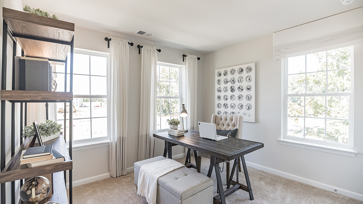 Second floor bedroom two can be used as an office space with three windows.