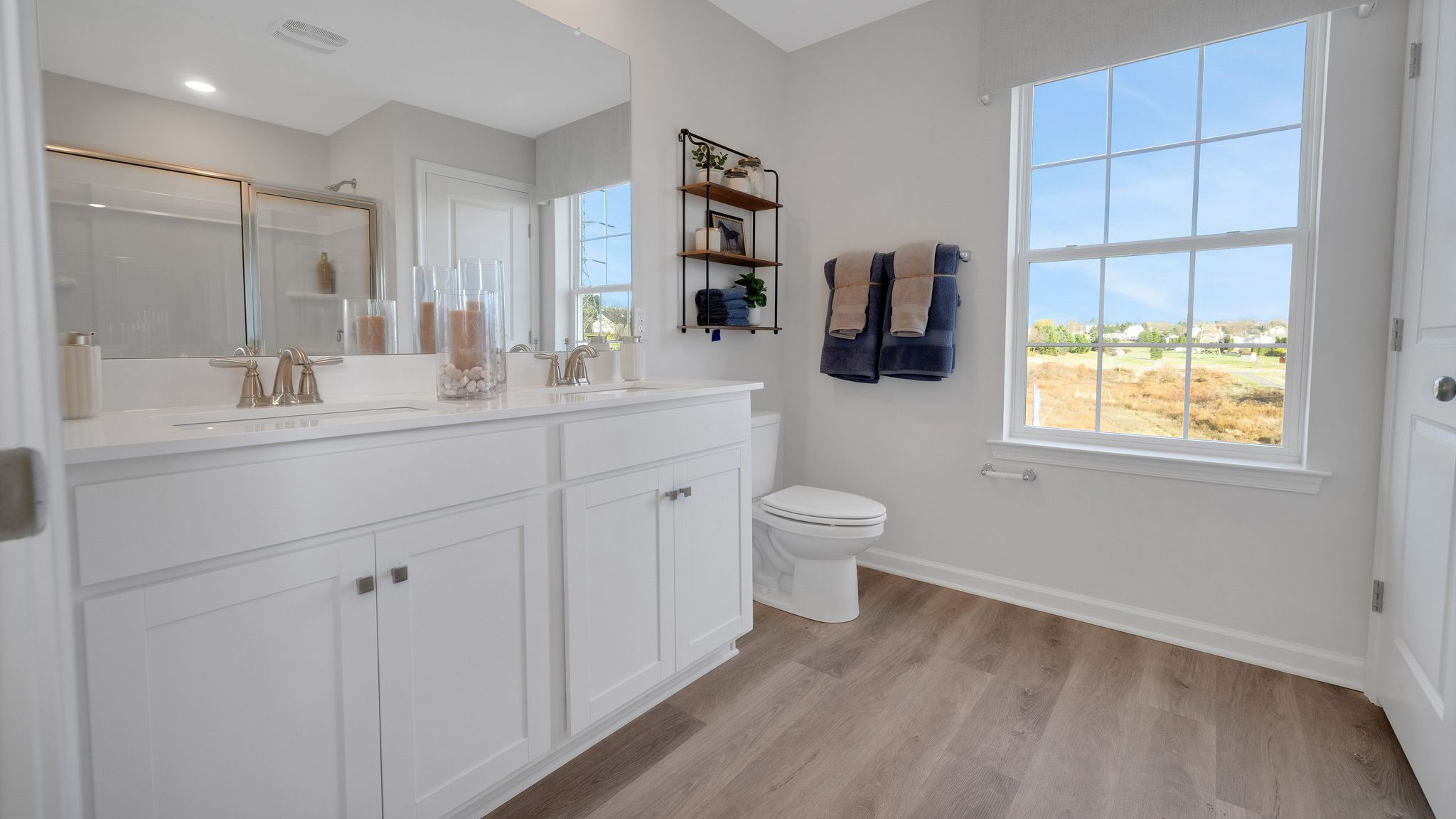 The primary bathroom has a double bowl vanity.