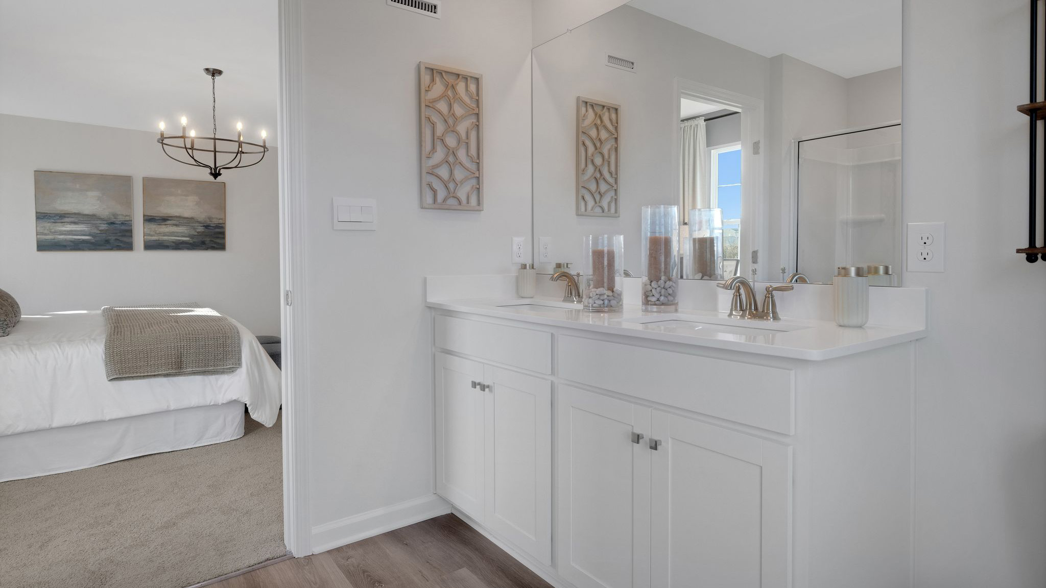 The primary bathroom has a double bowl vanity.
