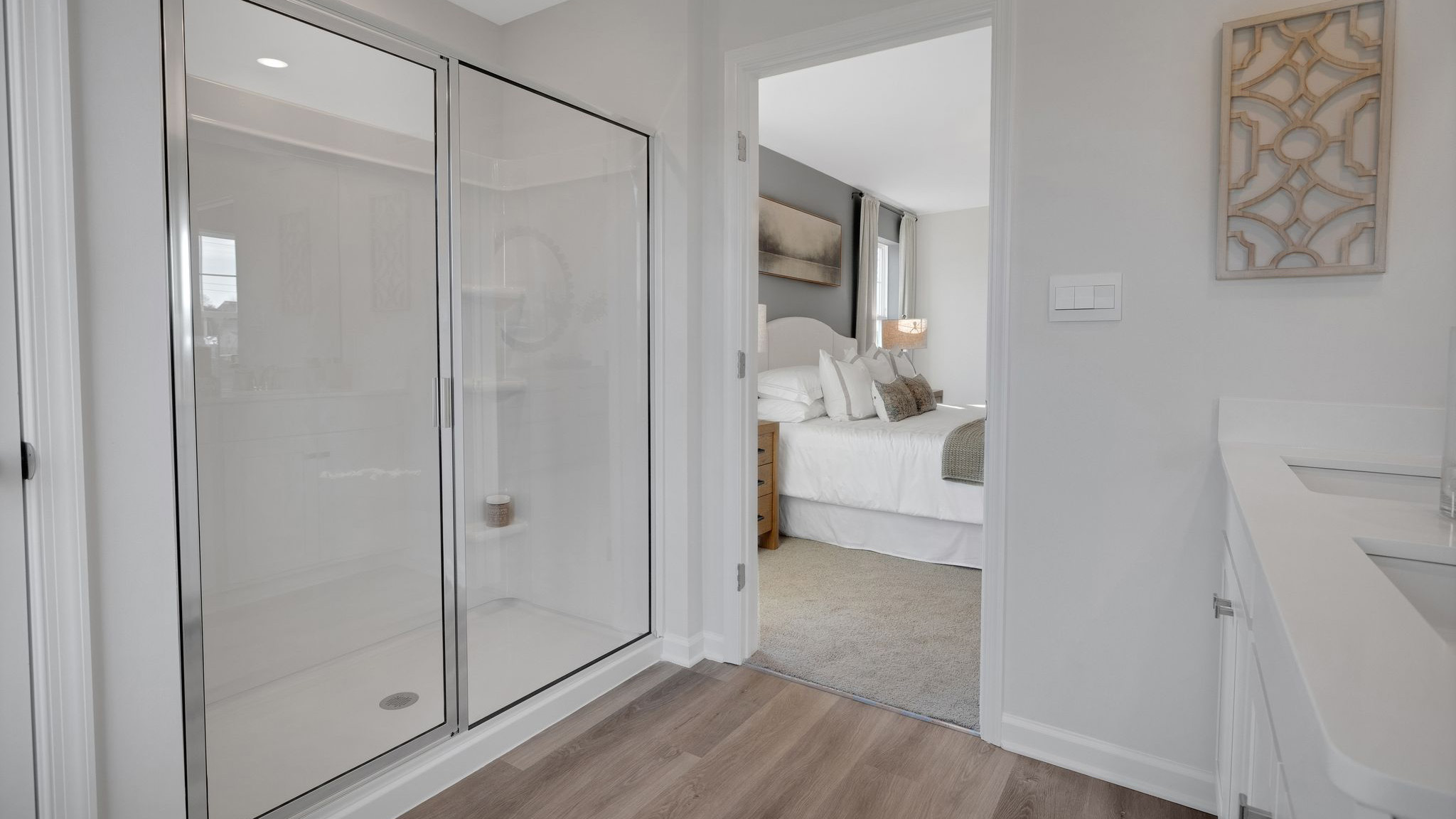 The primary bathroom has a large walk-in shower.