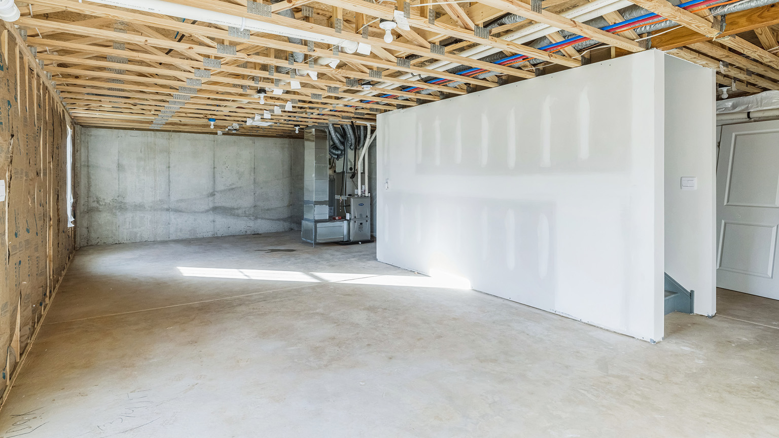 An interior view of the unfinished basement.