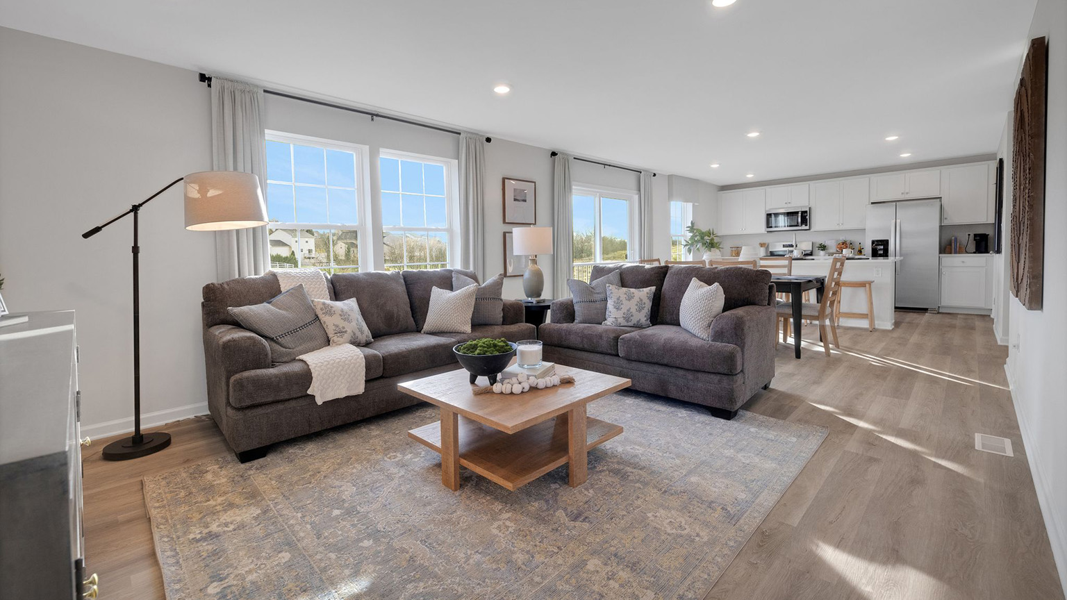 The windows give lots of light inside this open-concept living room.