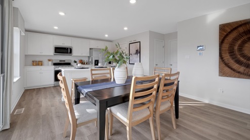 The dining room flows into the kitchen.