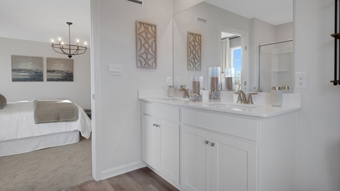 A double-bowl vanity adorns the primary bathroom.