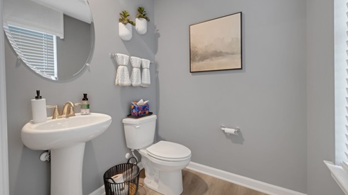 The first floor also offers a powder room.