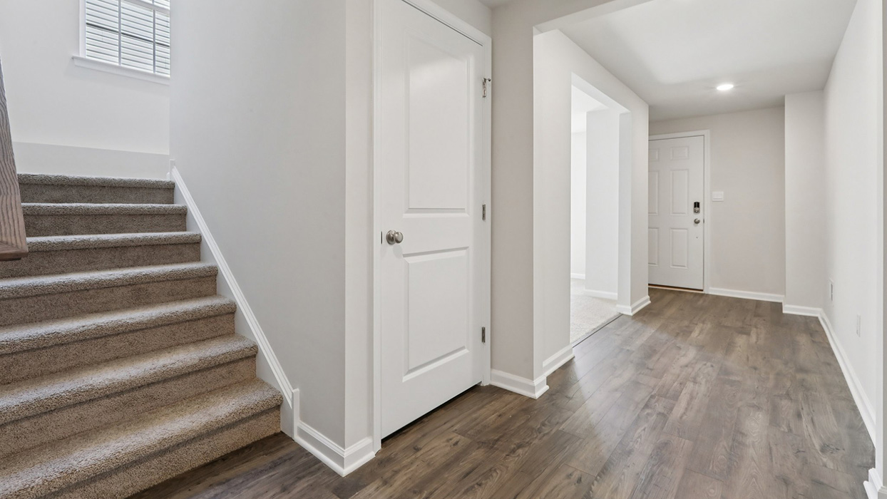 Entry way and inside view of the staircase to upstairs