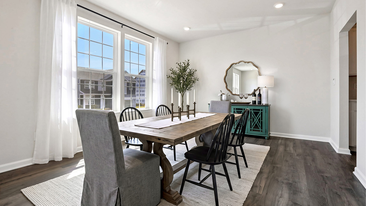 Formal dining with two large windows